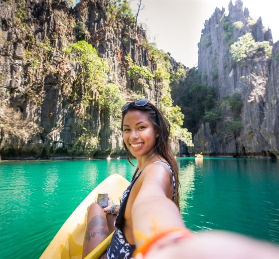 Traveler kayaking in a Cebu lagoon